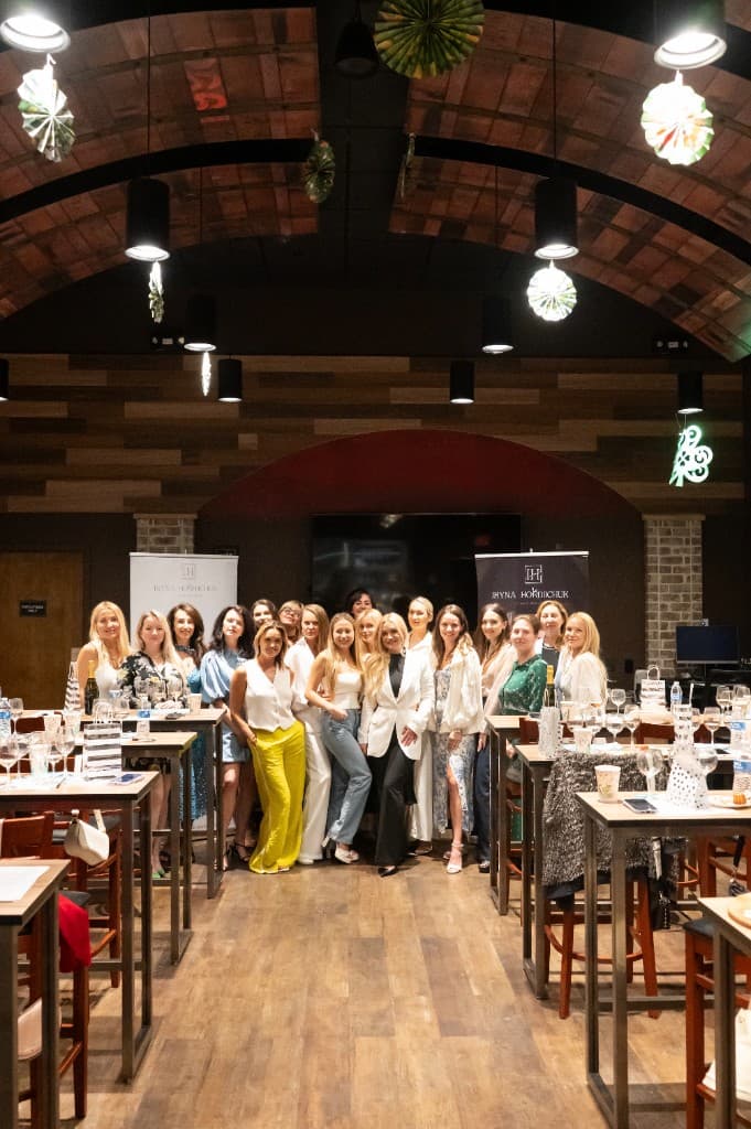 Event attendees gathered in a venue for a community beauty education night